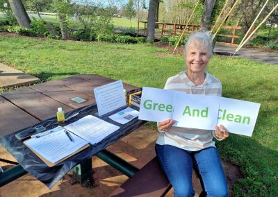 2025 Clean and Green Lady Holding Signs